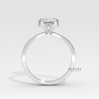 Side profile of a round cut moissanite engagement ring in a hidden halo solitaire setting