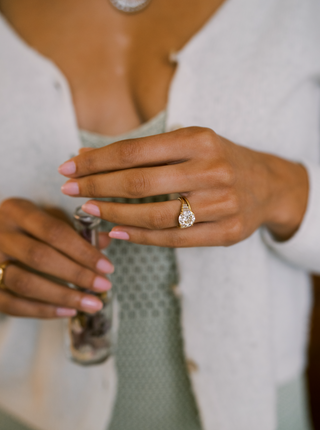 round cut moissanite ring seven stone hand view