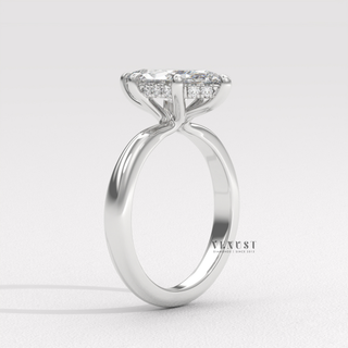 Centre-stone close-up of a marquise cut moissanite engagement ring in a hidden halo solitaire setting