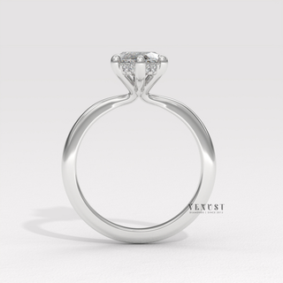 Profile shot of a marquise cut moissanite engagement ring in a hidden halo solitaire setting and its band