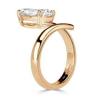 Pear moissanite open solitaire engagement ring on hand
