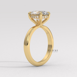 Centre-stone close-up of a oval cut moissanite engagement ring in a hidden halo solitaire setting