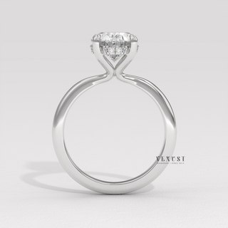 Front view of a oval cut moissanite engagement ring in a hidden halo solitaire setting