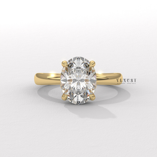 Oval cut moissanite engagement ring in a hidden halo solitaire setting shown on a finger