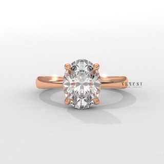 Overhead close-up of a oval cut moissanite engagement ring in a hidden halo solitaire setting