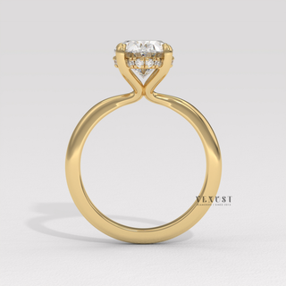 Profile shot of a oval cut moissanite engagement ring in a hidden halo solitaire setting and its band