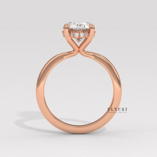 Full view of a oval cut moissanite engagement ring in a hidden halo solitaire setting with band detail