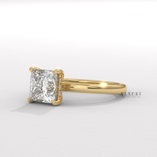 Angled view of a princess cut moissanite engagement ring in a hidden halo solitaire setting catching the light