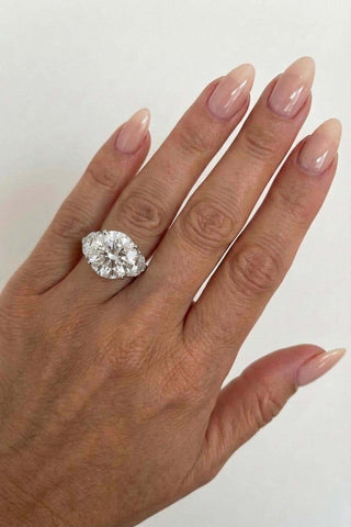 Round brilliant three stone moissanite engagement ring close up detail