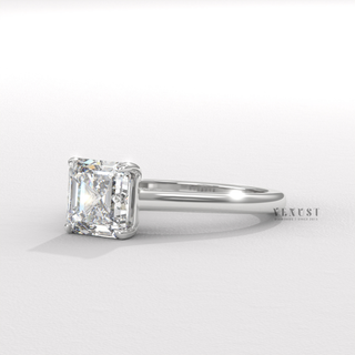 Detailed setting shot of a asscher cut moissanite engagement ring with a hidden halo and cathedral setting
