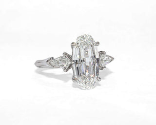 Oval step cut three stone moissanite engagement ring stone detail view