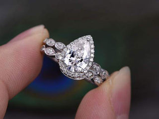 Classic 1.0ct pear halo moissanite ring side profile view