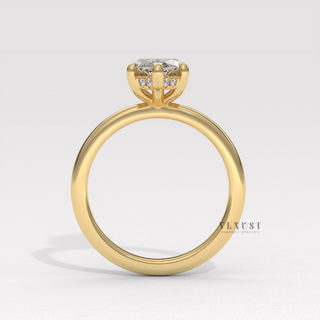 Front view of a marquise cut moissanite engagement ring in a hidden halo solitaire setting from the right