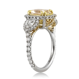 Yellow cushion three stone moissanite engagement ring stone detail view