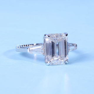 Timeless 2.0ct emerald three stone moissanite ring angled view showing its sparkle