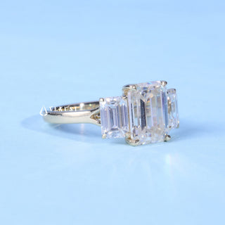 Dazzling 2.0ct emerald three stone moissanite ring angled view showing its sparkle