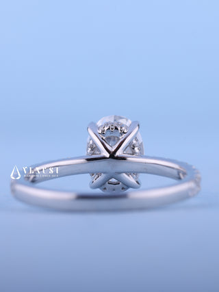 Sparkling 1.50ct oval hidden halo moissanite ring shown on a finger