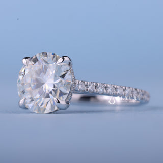 Shimmering 1.50ct round hidden halo moissanite ring angled view showing its sparkle