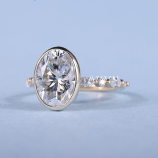 Delicate 2.0ct oval pave moissanite ring angled view showing its sparkle