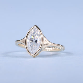 Exquisite 1.0ct marquise solitaire moissanite ring angled view showing its sparkle