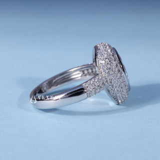 Side profile of Pear Cut Bezel Moissanite Halo Engagement Ring with Pave