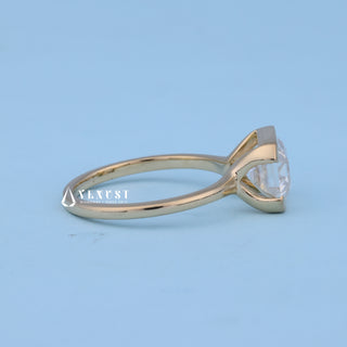 Side profile of East West Emerald Cut Bezel Engagement Ring with Moissanite