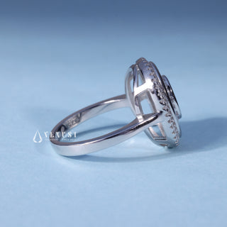 Side profile of Oval Cut Bezel Set Moissanite Engagement Ring with Halo