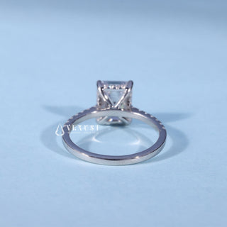 Angled view of Hidden Halo Emerald Cut Engagement Ring with Moissanite Pave