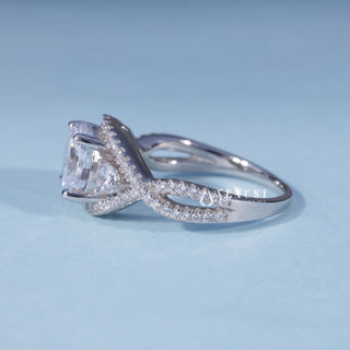 Angled view of Round Moissanite Split Shank Halo Engagement Ring with Pave