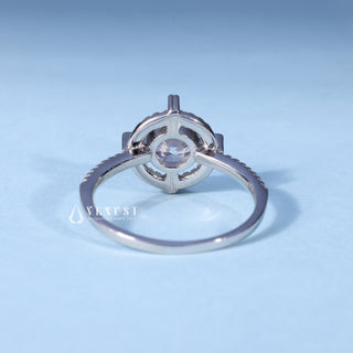 Angled view of Round Brilliant Moissanite Halo Pave Engagement Ring