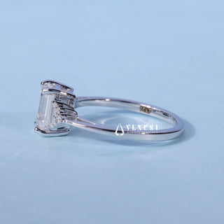 Angled view of Emerald Cut Three Stone Moissanite Engagement Ring