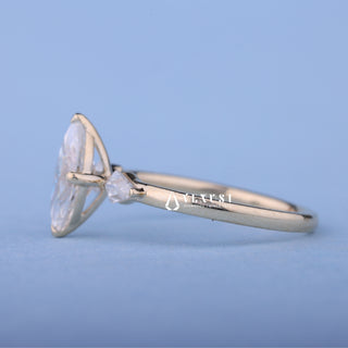 Angled view of Marquise Cut Moissanite Engagement Ring with Side Stones