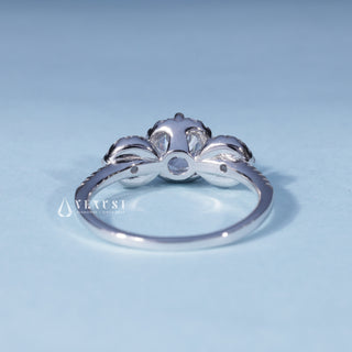 Angled view of Round Halo 3 Stone Moissanite Engagement Ring with Pave