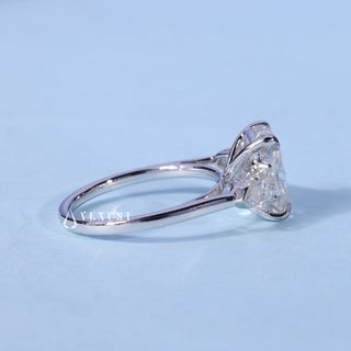 Angled view of Three Stone Cushion Cut Moissanite Engagement Ring