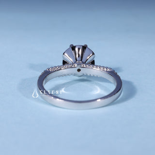 Angled view of Round Cut Vintage Moissanite Engagement Ring with Filigree