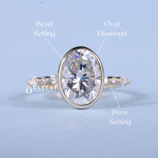 Delicate 2.0ct oval pave moissanite ring shown on a finger