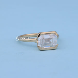 Rear gallery view of East West Emerald Cut Bezel Engagement Ring with Moissanite