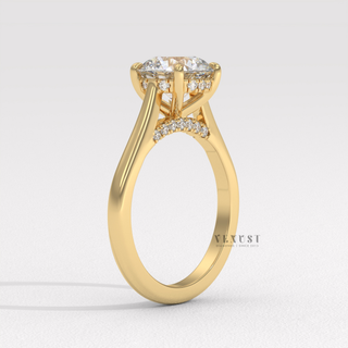 Profile shot of a round brilliant moissanite engagement ring with a hidden halo and cathedral setting and its band