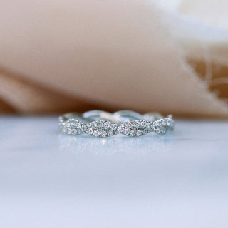 Vintage round full eternity moissanite wedding band three quarter angled view
