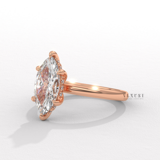 Marquise cut moissanite engagement ring in a hidden halo solitaire setting worn on a hand