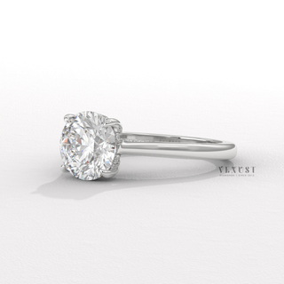 Lifestyle photo of a round brilliant moissanite engagement ring with a hidden halo and cathedral setting on the hand
