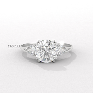 Three stone round brilliant moissanite ring close up