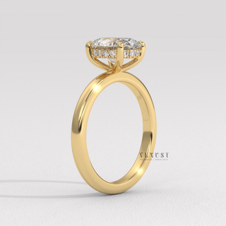 Side profile of a oval cut moissanite engagement ring in a hidden halo solitaire setting from the left