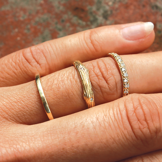 Refined round half eternity moissanite wedding band three quarter angled view image 2