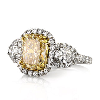 Yellow cushion three stone moissanite engagement ring side view